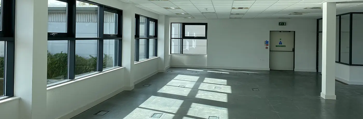 Internal of an empty office building, showing daylight shining across the floor. SEA Consulting were brought in to make improvements for the landlord and support with daylight calculations